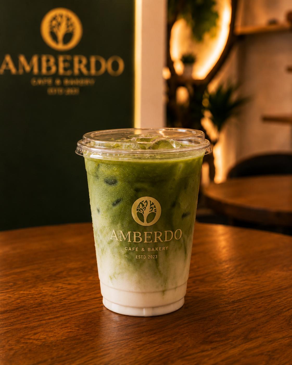 Iced matcha latte in an Amberdo cup